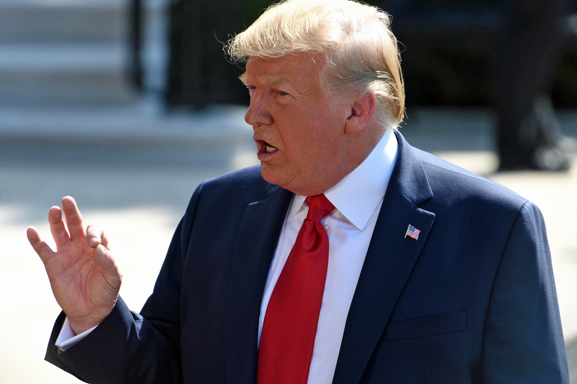 Donald Trump speaks to members of the press prior to his departure on Marine One from the White House on August 9 2019.