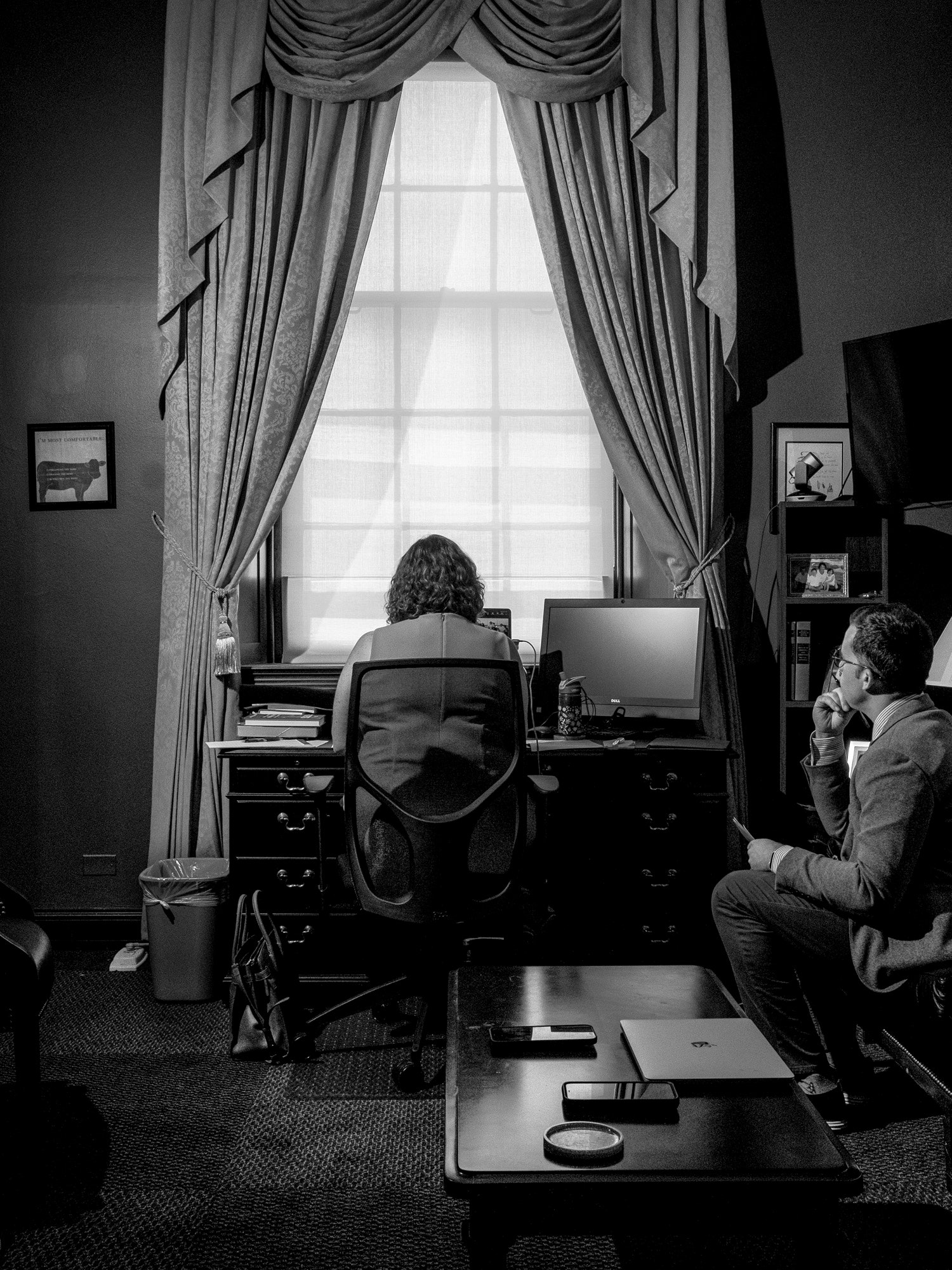 Porter at her desk in her D.C. office where she sheltered from rioters on January 6.