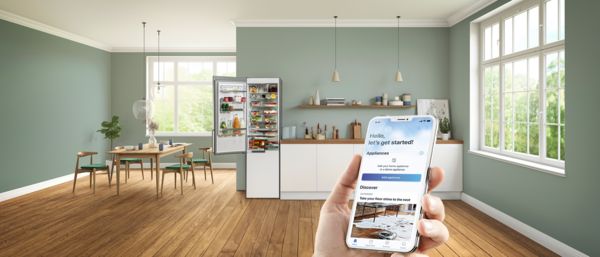 Un jeune couple utilise l'application Home Connect