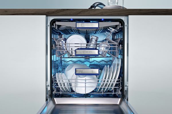 An open dishwasher with a Home Connect function.