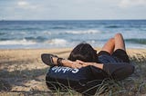 person resting on the beach