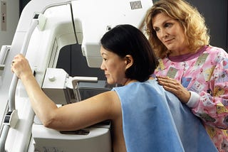 A woman undergoing mammography.