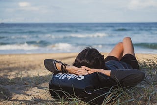 person resting on the beach