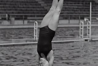 Woman diving into a swimming pool