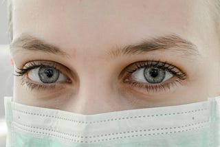 A woman wearing a mask.