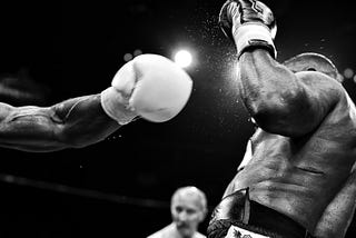 An image of two boxers and a referee