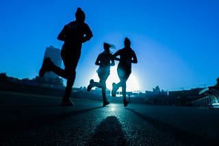 three people running