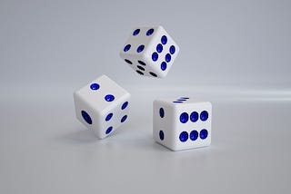 Three dice in various stages of rolling.