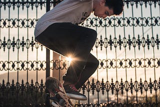 Young male on a skateboard doing a kick flip