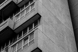 Black and white photo of a block of flats