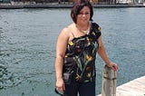 Picture of the author standing on a pier at the lake.