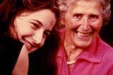 An older woman and a younger woman smiling for the camera