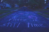 A screenshot from the movie “I Saw the TV Glow” showing a chalk drawing on the street.