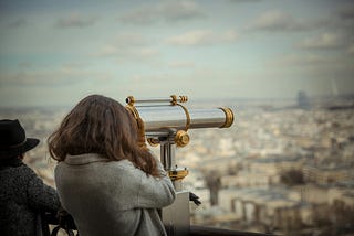 person using telescope