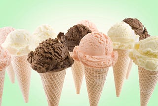 several ice cream cones against pale green background