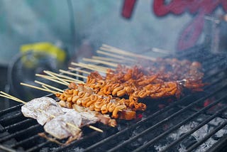 Mmm, this is a picture of some delicious and tender kebabs. Grilled meat is always common at cookouts, especially Filipino ones.