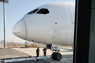 A plane parked at a gate at Haneda Airport, Tokyo.