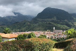 View of a town in Colombia nestled into the green Andes mountains