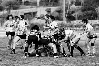 Black and white photo of women playing sport