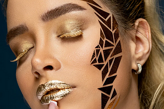 A woman with golden makeup