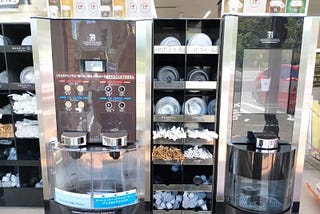 Photo of a couple of coffee machines on the counter in a Japanese convenience store.