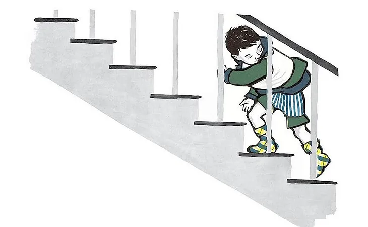 A boy walking down stairs in “The Backward Day”