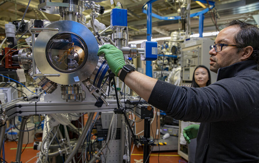 Ethan Crumlin (far right) and Staff Scientist Jin Qian in the Advanced Light Source