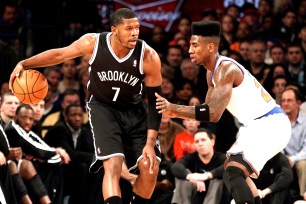 Joe Johnson dribbles with Iman Shumpert defending.