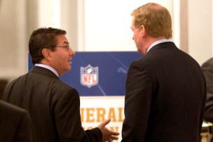 Redskins owner Dan Snyder (left) talks with Roger Goodell at the NFL Owners meetings