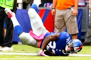 David Wilson hits the ground against the Eagles