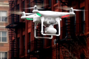 A camera-equipped drone buzzes over East Harlem.