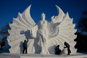 HARBIN, CHINA - DECEMBER 22: Sculptors work on a snow sculpture of Newton in the 16th Harbin Ice and Snow World, which will officially open on January 5 on December 22, 2014 in Harbin, China. PHOTOGRAPH BY Feature China / Barcroft Media UK Office, London. T +44 845 370 2233 W www.barcroftmedia.com USA Office, New York City. T +1 212 796 2458 W www.barcroftusa.com Indian Office, Delhi. T +91 11 4053 2429 W www.barcroftindia.com