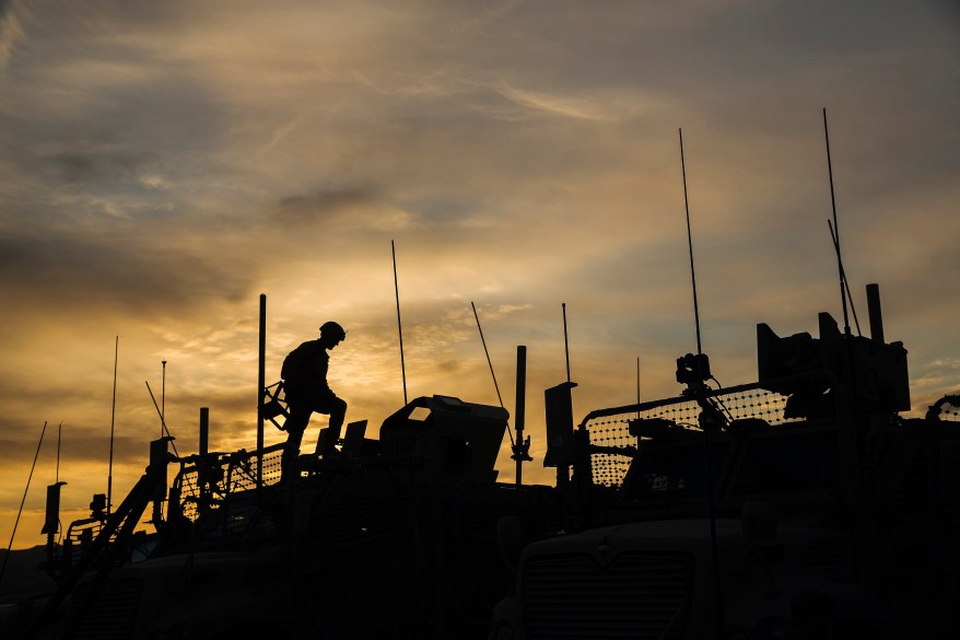 A U.S. soldier from the 3rd Cavalry Regiment prepares his Mine-Resistant Ambush Protected (MRAP) vehicle for a mission on forward operating base Gamberi in the Laghman province of Afghanistan December 12, 2014. REUTERS/Lucas Jackson (AFGHANISTAN - Tags: CIVIL UNREST POLITICS MILITARY TPX IMAGES OF THE DAY)