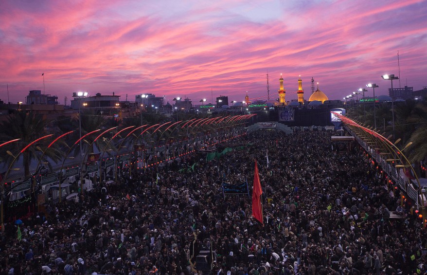 Shi'ite Muslim pilgrims gather as they commemorate Arbain in Kerbala, southwest of Baghdad December 12, 2014. Hundreds of thousands of black-clad pilgrims from across Iraq streamed into the city of Kerbala on Friday a day before the culmination of Saturday's Arbain, which marks the end of 40 days of mourning for Imam Hussein, a grandson of the Prophet Mohammed, who died in a 7th century battle at Kerbala. REUTERS/Stringer (IRAQ - Tags: RELIGION SOCIETY)