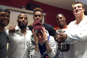 A group of New England Patriots including star tight end Rob Gronkowski (far right) met singer Justin Bieber on Monday night.