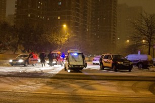 Cops investigate scene where a security guard was shot in The Bronx.