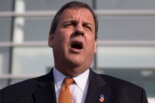 Chris Christie speaks outside the One Nucleus life science company headquarters in Cambridge, England on Monday.