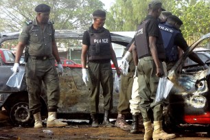 Police bomb experts sweep the scene of a twin suicide blast at Kano Line bus station Nigeria’s largest city of Kano on February 24th.