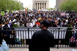 Cephus "Bobby" Johnson, bottom center, uncle of Oscar Grant, addresses marchers outside Baltimore City Hall, Saturday, May 2nd.