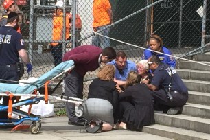 People at the scene in Morningside Heights on 113th Street and Amsterdam Avenue.