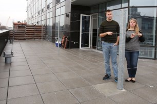 Erik Clancy, with Erin McFadzen, behind their fenced off "poor porch" in December.