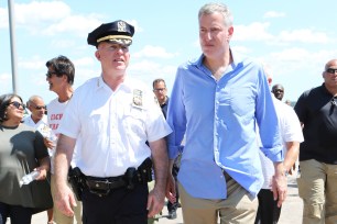 James O'Neill and Bill de Blasio took a stroll down the Orchard Beach boardwalk.