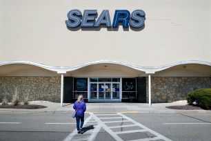 A shopper walks up to a Sears department store at the Tri-County Mall, in Springdale, Ohio.