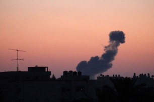 Smoke rises following an Israeli air strike in the central Gaza Strip