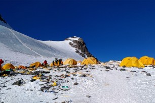 Discarded climbing equipment and rubbish scattered around Camp 4 of Mount Everest.