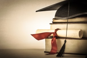 Books and a graduation cap