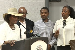 Deputy New York Assembly Speaker Earlene Hooper, left speaks during a meeting in Hempstead as her challenger Taylor Raynor, right, looks on.