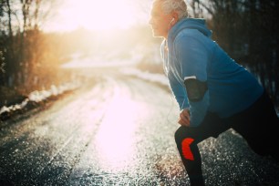 An active senior man gets ready to workout