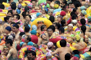 Swimmers jostle for space in a pool in Nanjing, China during a heatwave in 2009.