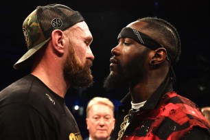 Tyson Fury is confronted by rival boxer Deontay Wilder after defeating Francesco Pianeta in a heavyweight bout Saturday in Belfast.